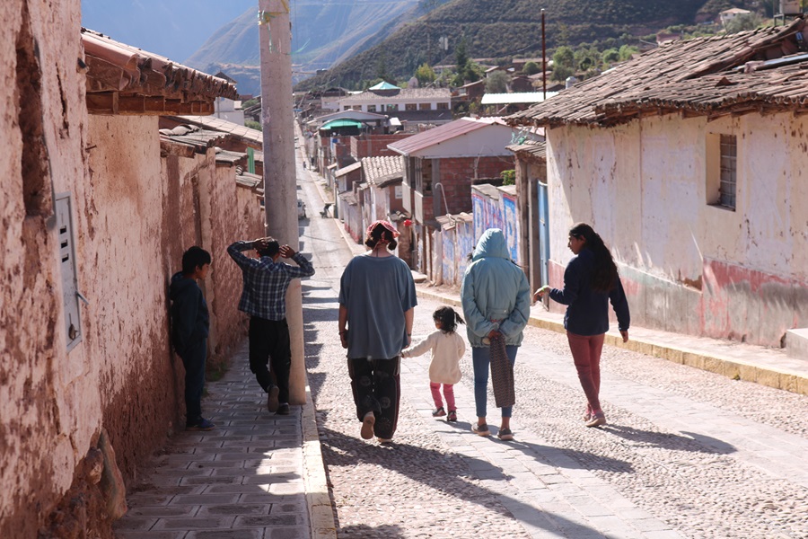 Taken in Caicay Peru, In July of 2022 - A couple of local kids giving their visitors a tour of town. This intercultural moment reflects on the inevitable human connection even through vast differences in lifestyle.